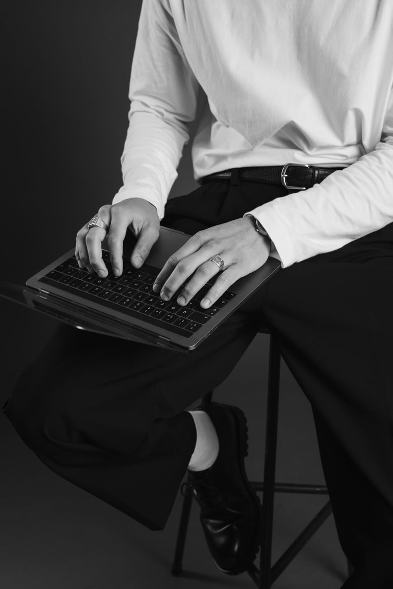 Man Typing on a Laptop